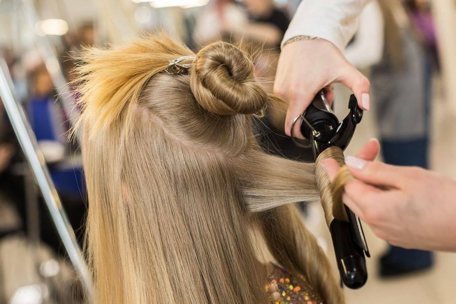 Competitors work with long hair