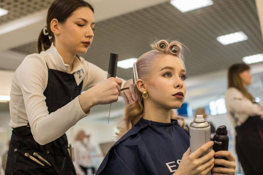 As a rule, models actively help them: holding hairspray, bobby pins, and curling irons