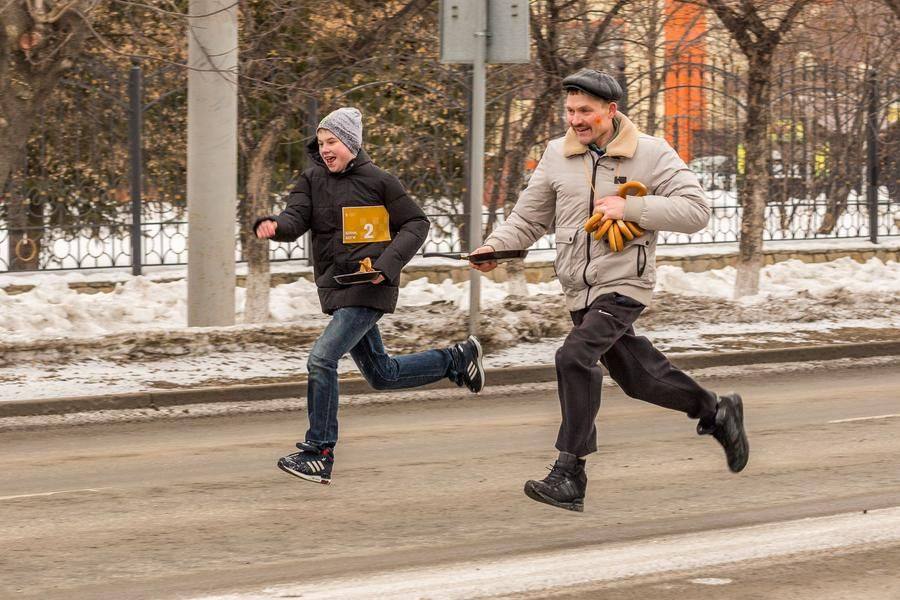 By the way, runners must keep the pancake from falling off the pan while racing