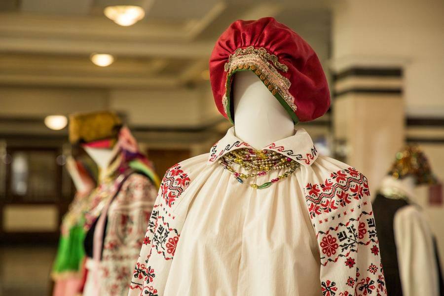In the foyer, visitors are greeted by an exhibition of festive outfits