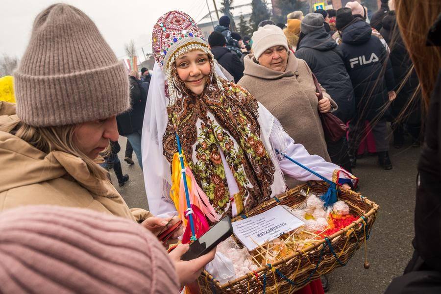 Street vendors are busy trading: prices are symbolic, and the goods are all themed