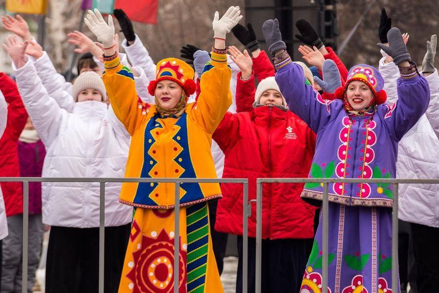 To a lively tune, the jesters greet the gathered crowd