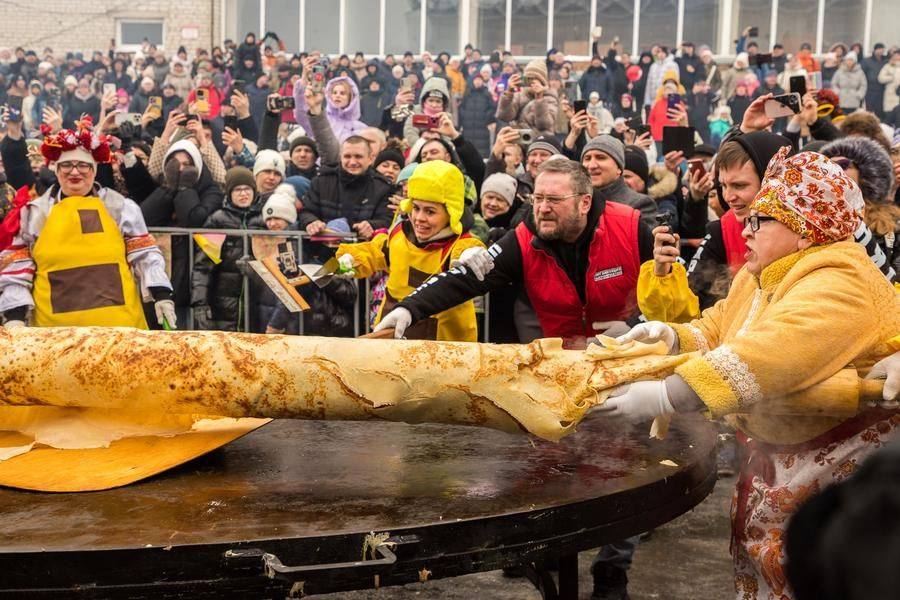 Now the pancake must be carefully transferred and just as carefully unrolled