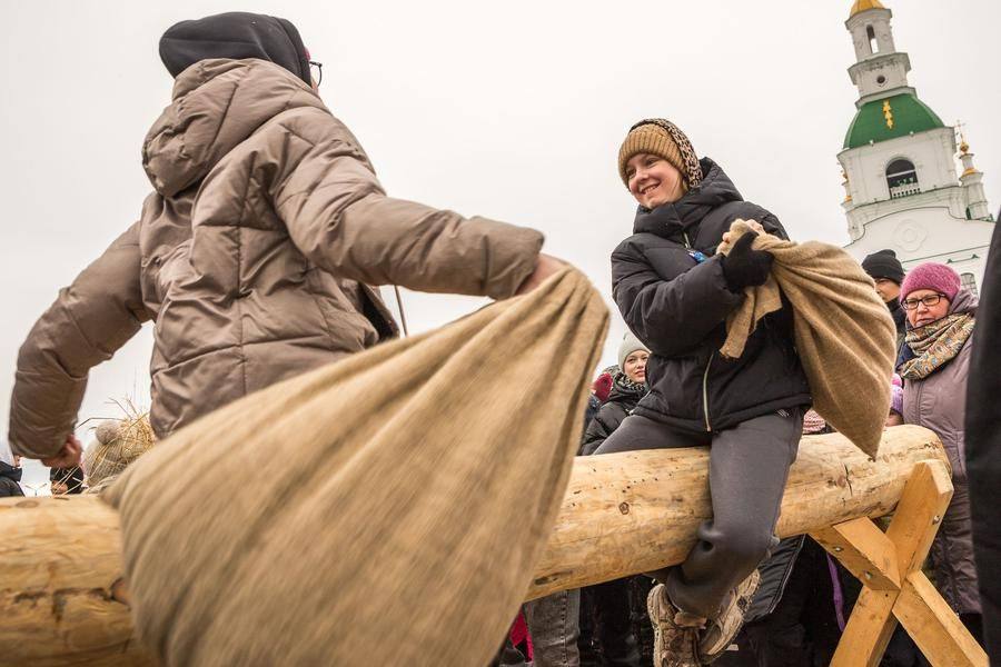 Knocking an opponent off a log with a sack — a classic and wildly popular pastime