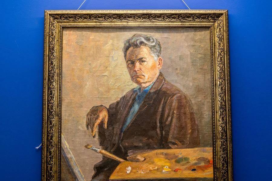 Upstairs, guests are greeted by the founder’s self‑portrait painted in Alexandrovka in 1972