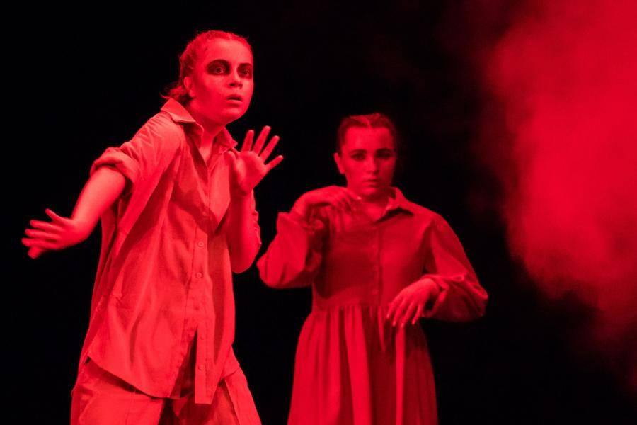 Blood-red tones intensify the sense of perpetual danger