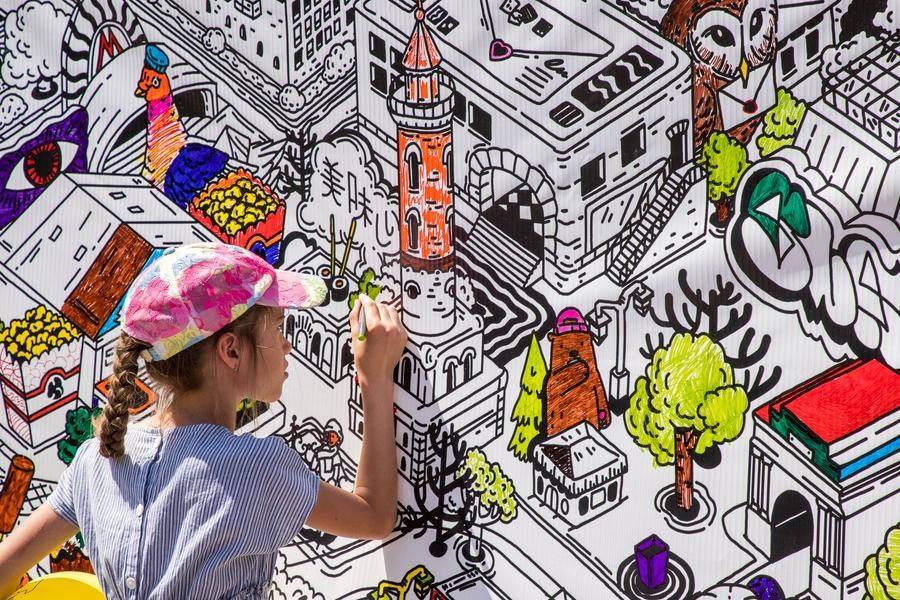 At one stand, kids can color in an entire cityscape