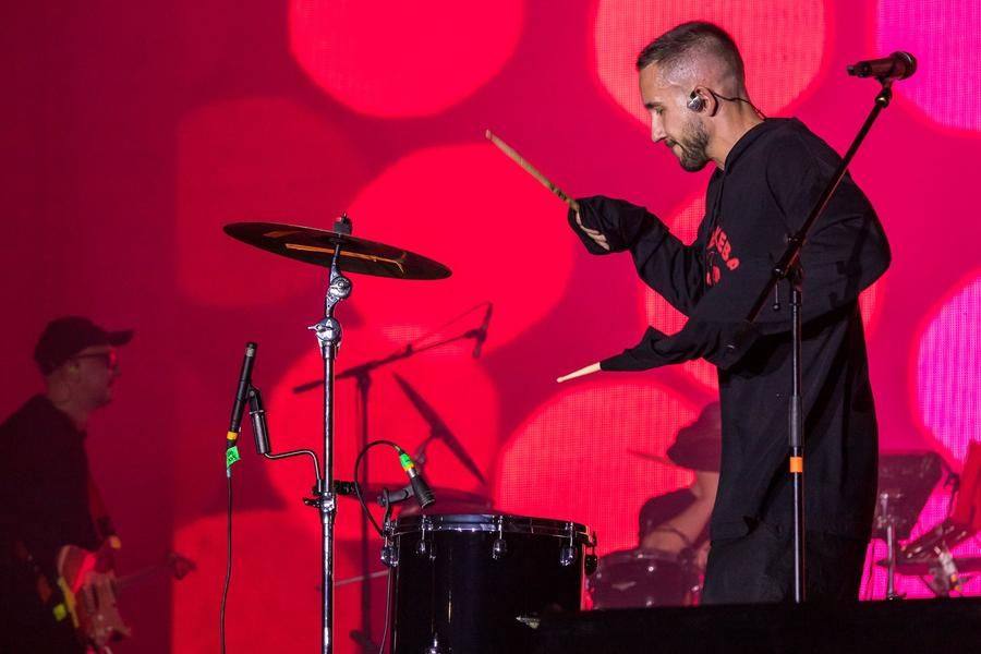 A lone drum kit in the center of the stage is used for just one number