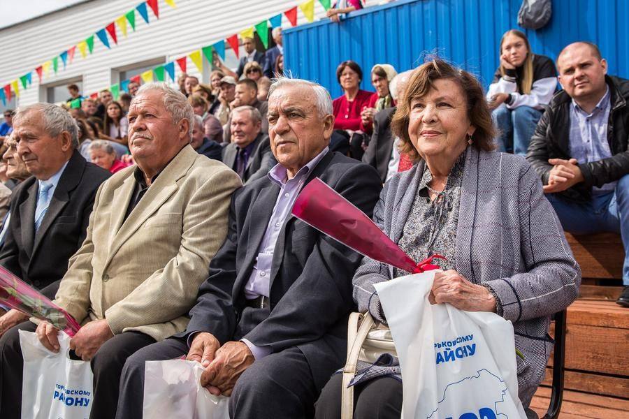 Honorary residents of the district watch the performance with close attention