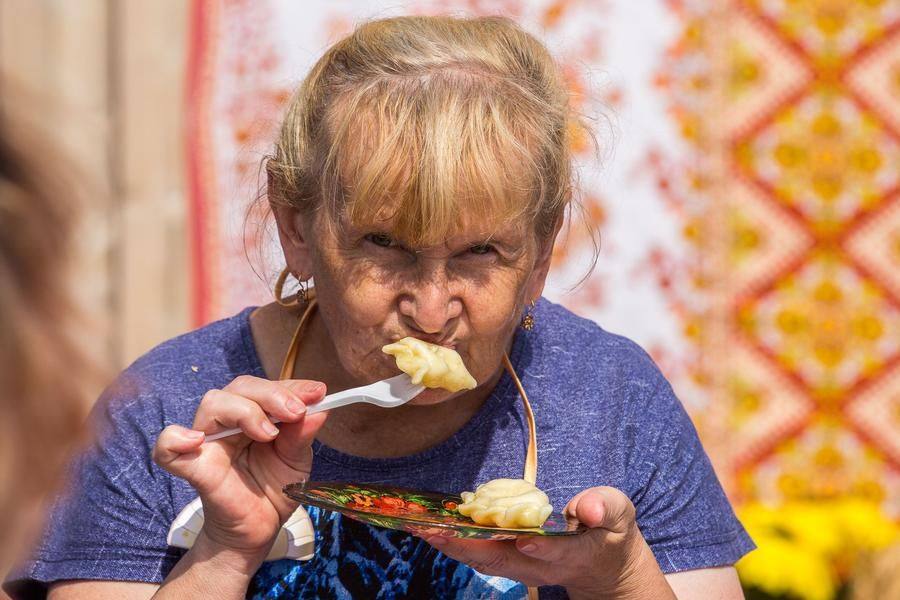 As the jury moves to the next table, guests of the festival are treated to dumplings