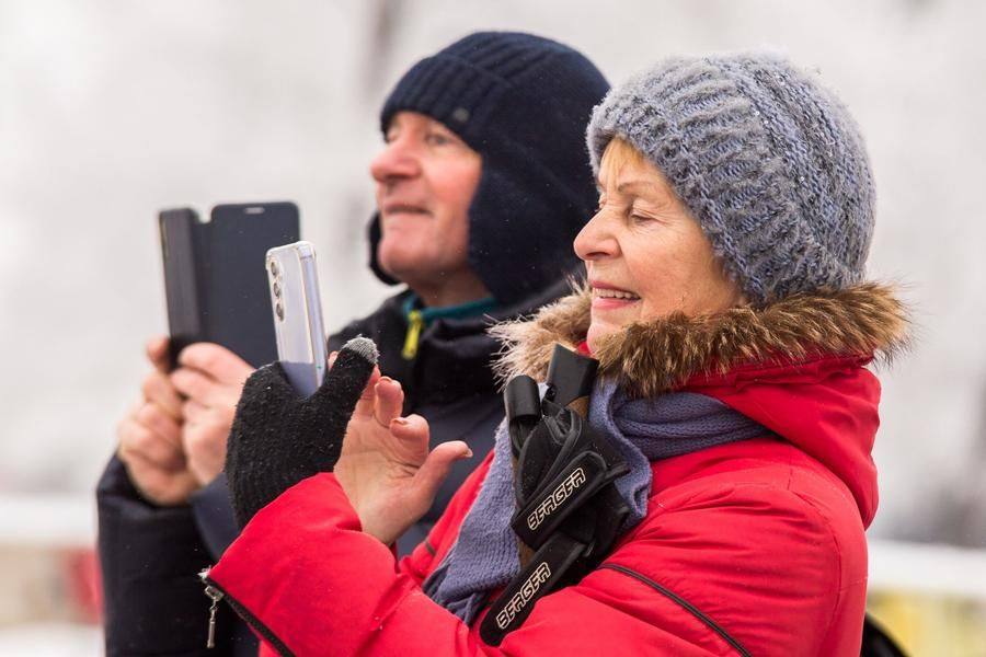Onlookers try to capture the most touching moments on camera