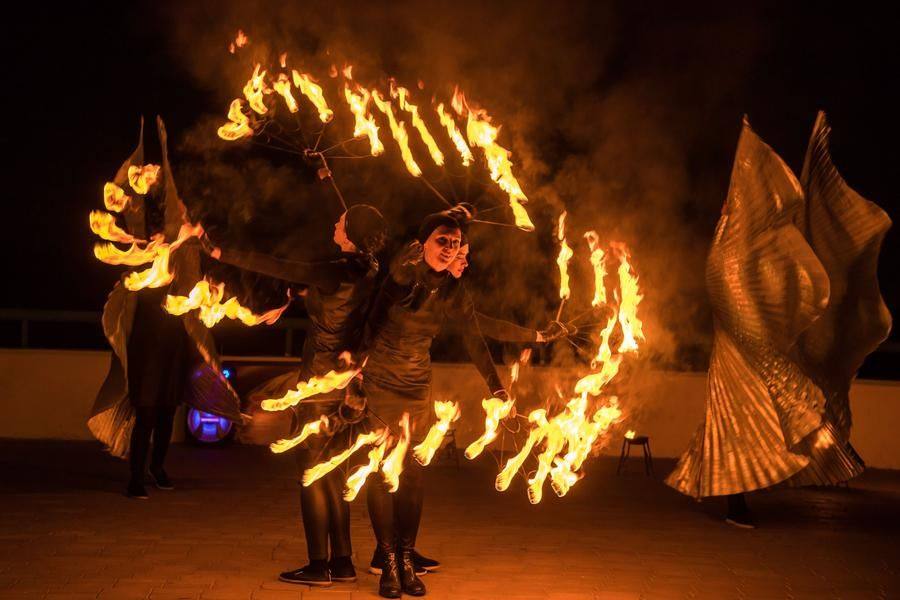The flame dramatically amplifies the impact of both music and choreography