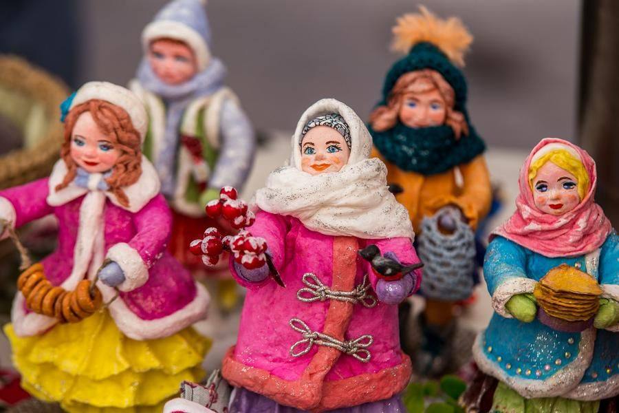 Many stalls sell souvenirs, like handmade dolls by Nadezhda Nesterskaya