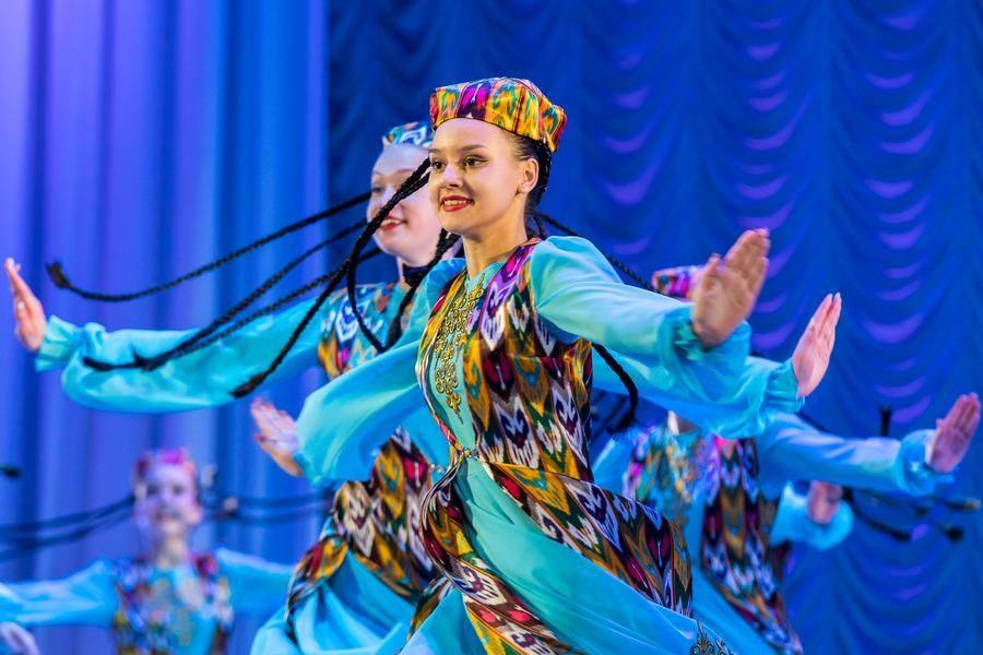 In the original version, the dancers’ braids number forty — a striking visual detail