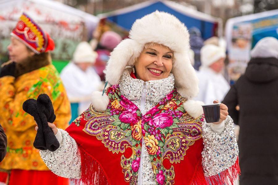 Performers and tourists cheer the acts on, dancing right there on the square