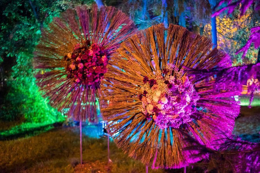 The installations transform under the light of colorfully shaped, whimsical lamps
