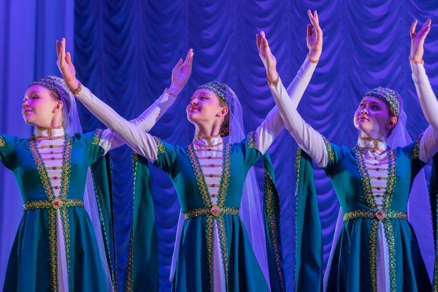 In the Armenian women’s dance, the performers showcase poise and a refined sense of presence