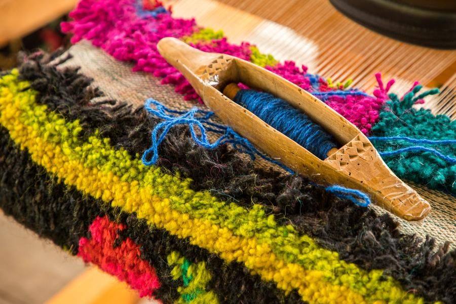 This fragment shows the color combination typical of Krestiki rugs