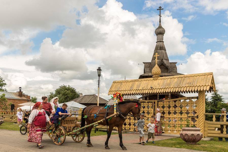 The procession stops at the church