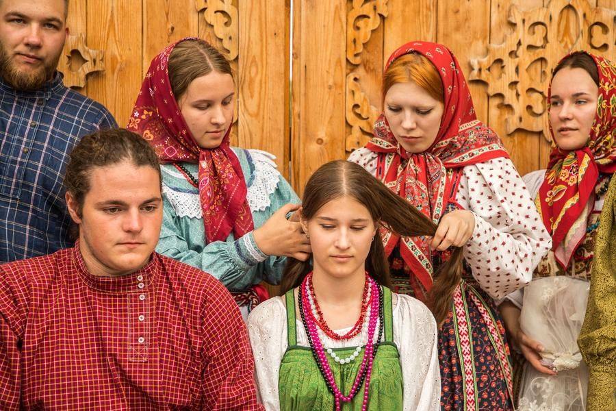 The young woman’s hairstyle and headdress must change