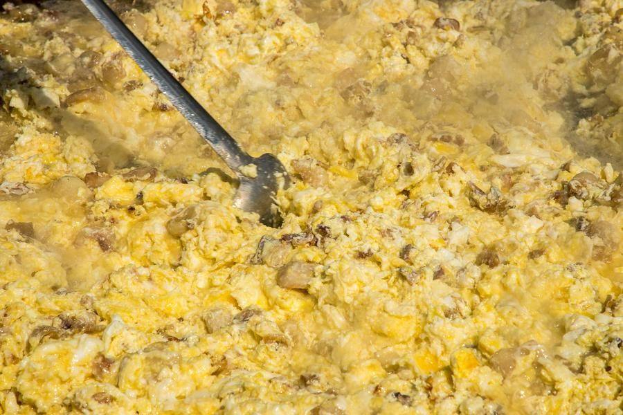 It’s a huge scrambled egg with cracklings that sizzle as they fry