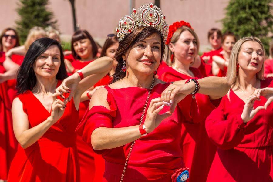 The dance is performed to a song written especially for ladies in red dresses