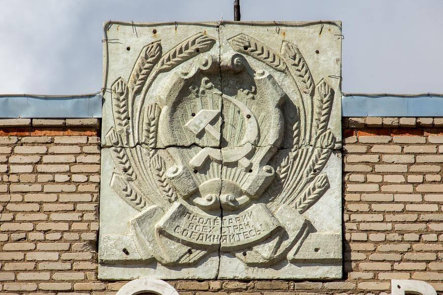 The administrative building still bears the heraldry of a bygone era