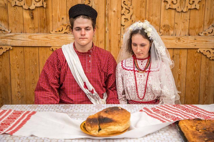 After the blessing, the couple is seated at the table