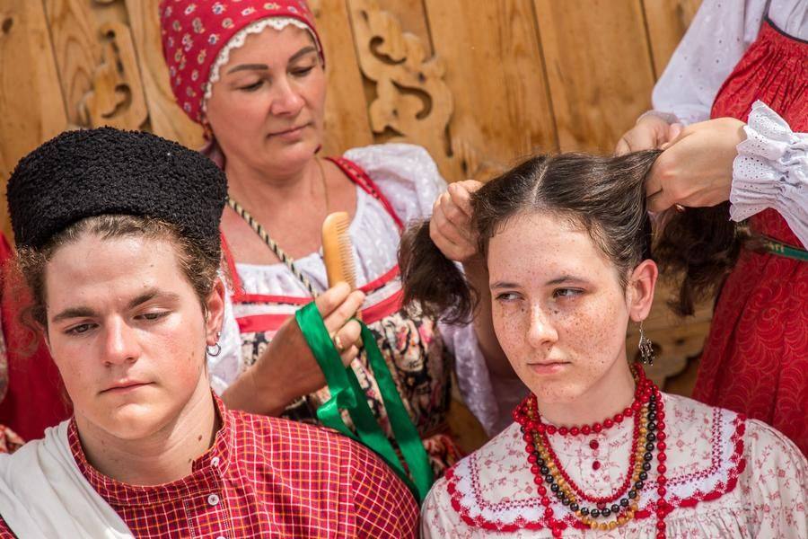 The final major wedding rite begins — combing the hair and then changing the headdress