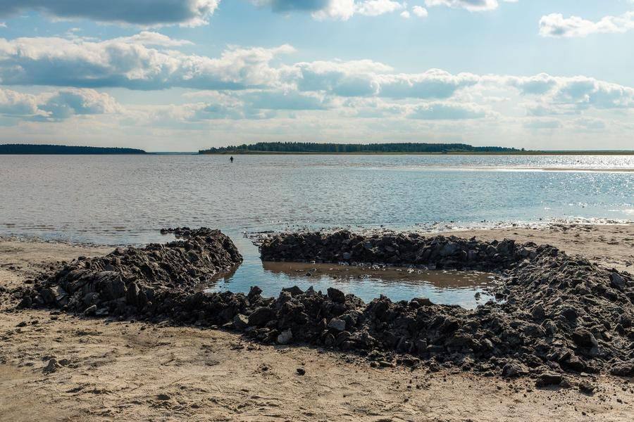 Preparations are set on the shore of the salt lake for several rounds of mud games