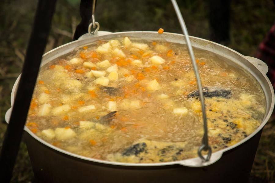 Eleven teams are cooking fish soup using their own recipes