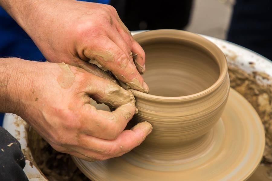 In just a few minutes, a lump of clay takes the shape of a graceful little pot