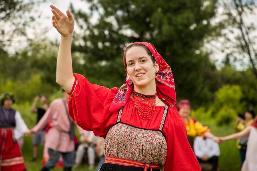 The young women wave their arms, setting the rhythm for this endless movement