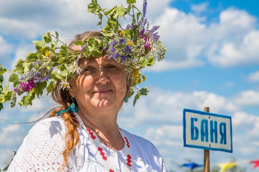 Today, everyone at the festival has a wreath — even the bathhouse attendant!