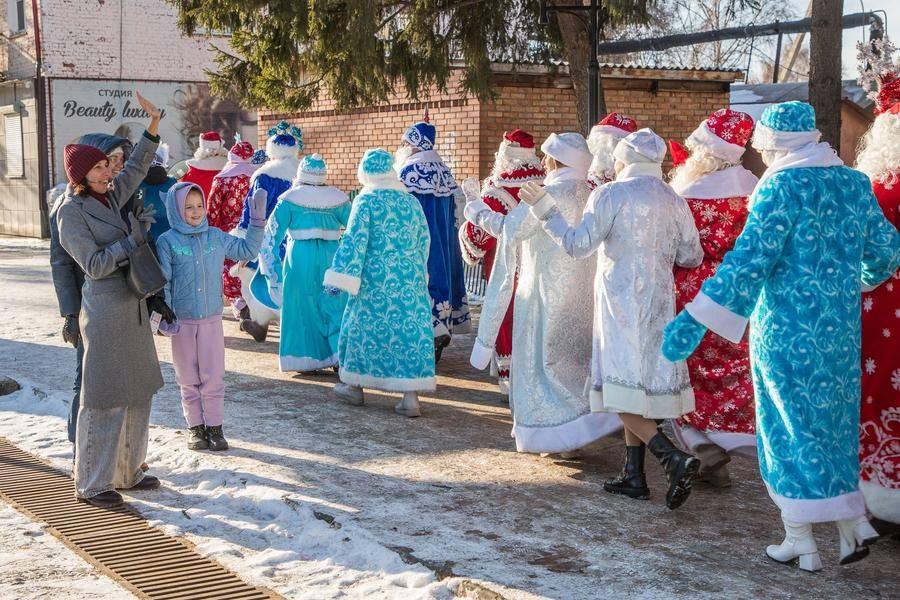 Random passersby cheerfully welcome the procession