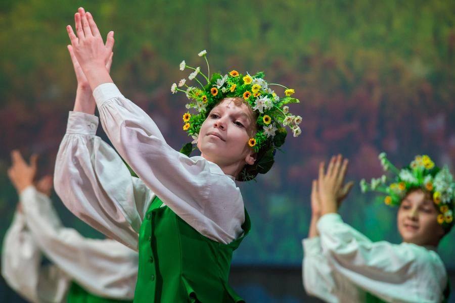 The troupe takes the stage with the Latvian game-dance “Govju Kazāks”