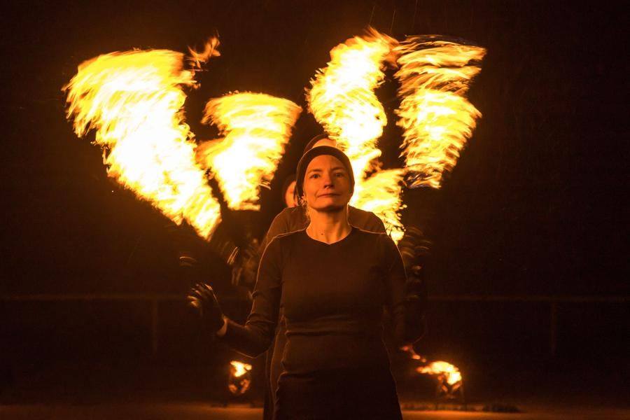 Lydia Pospelova framed by the halo of flame
