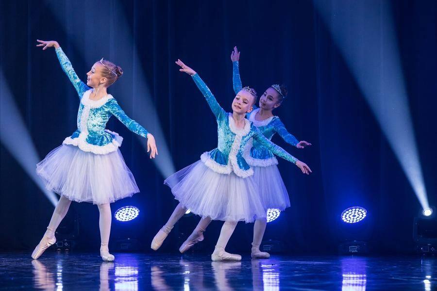 The younger girls help the senior cast develop the theme