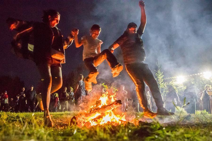 People jump alone, in pairs, and as whole families