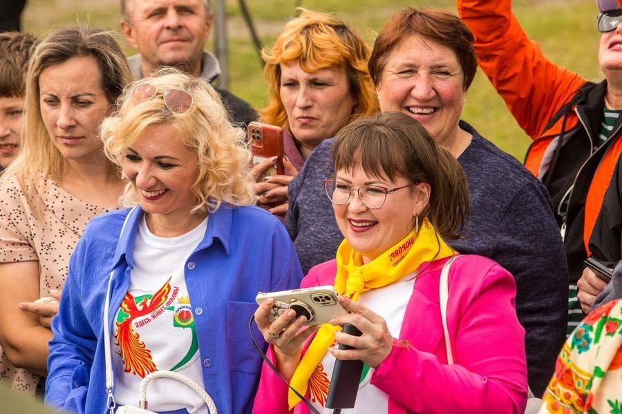 Adults watch and cheer them on