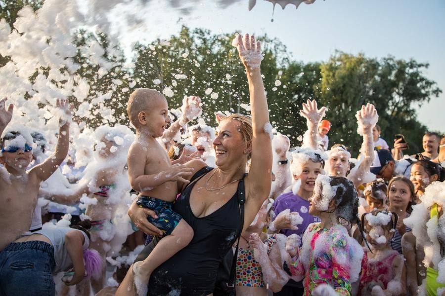 Both kids and adults dive into the fun with equal excitement