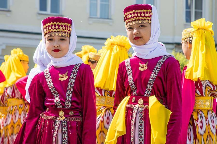 The vibrant colors and ornaments suit the young performers perfectly