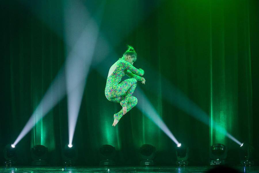 Spotlights draw all attention to the graceful performer