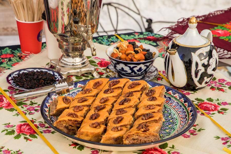 Uzbek treats are also on display, served with green tea kok‑choy — a symbol of hospitality