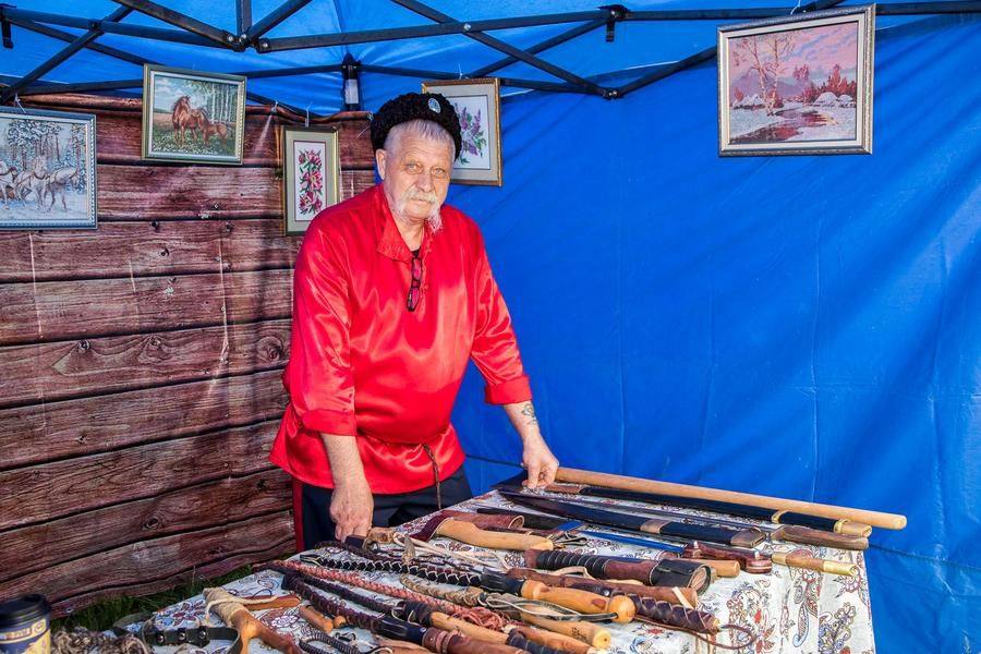 Nikolay Kravchenko, elder of Zavodoukovsk Cossack society, shows off traditional weapons