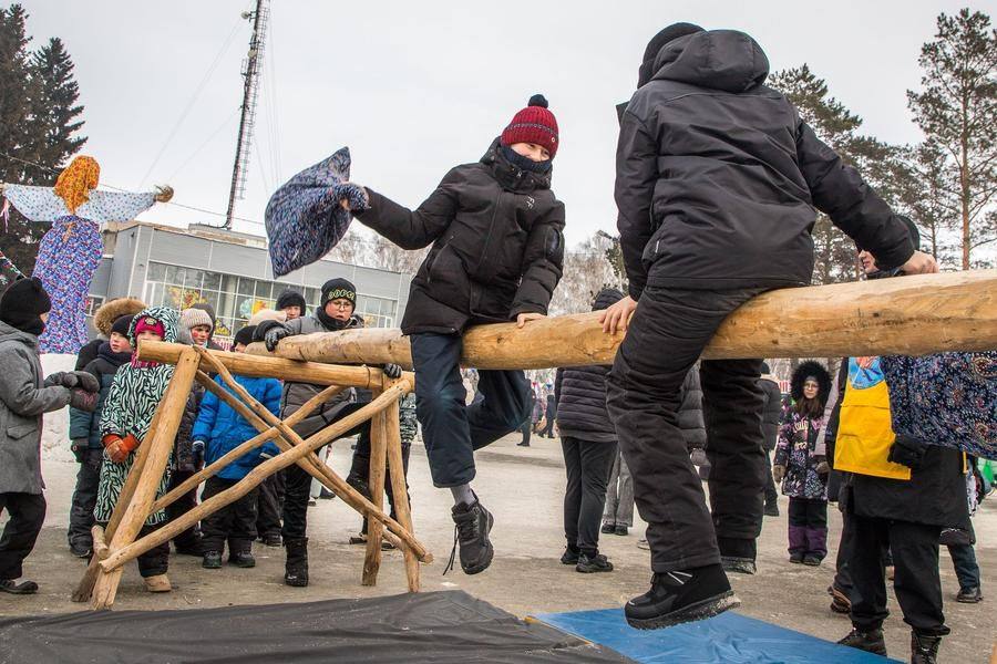 Pillow fights take place on a wide, smooth log