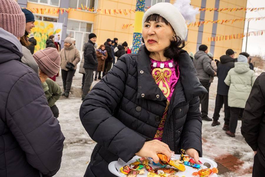 By tradition, sweets are scattered around — a way to share happiness with everyone nearby