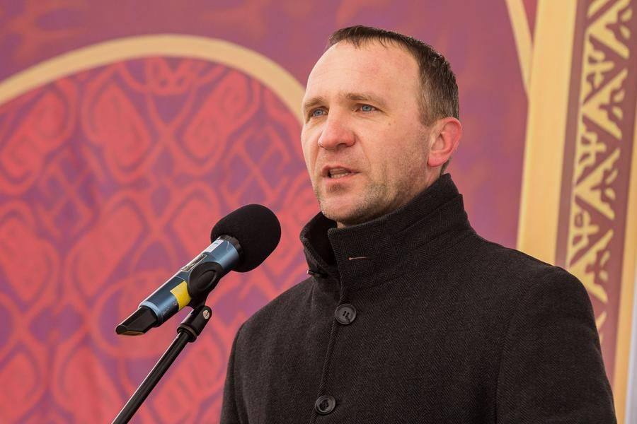 Evgeny Zhuravlev, the head of the district, addresses the audience with warm greetings