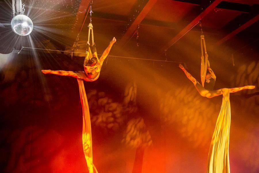 The gymnasts’ movements are as synchronized as the equipment allows