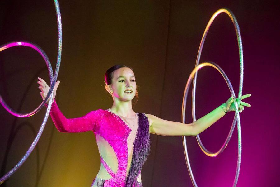She effortlessly handles dozens of hoops, moving to the rhythm of the dance
